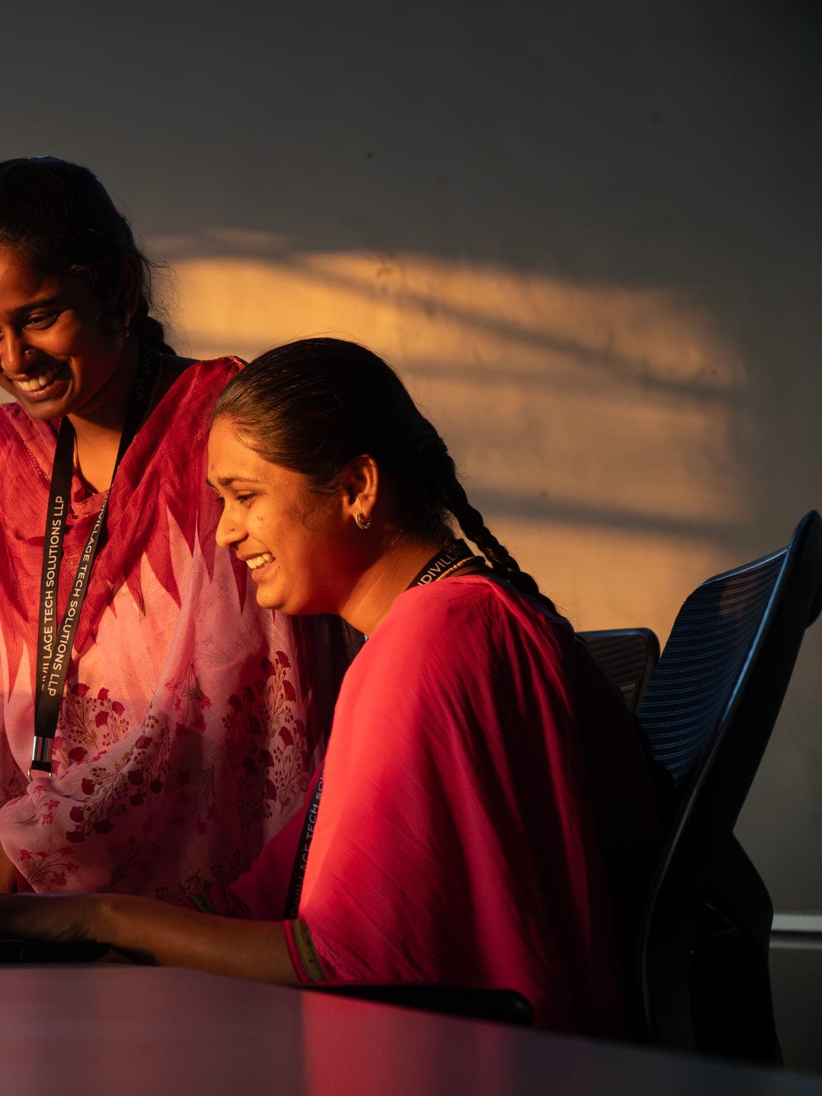 Sector closing CTA — IndiVillage specialist at workstation