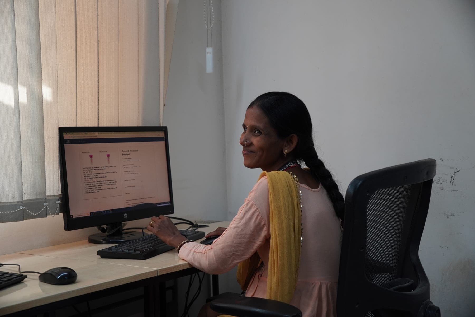 IndiVillage platform specialist at workstation, Bengaluru