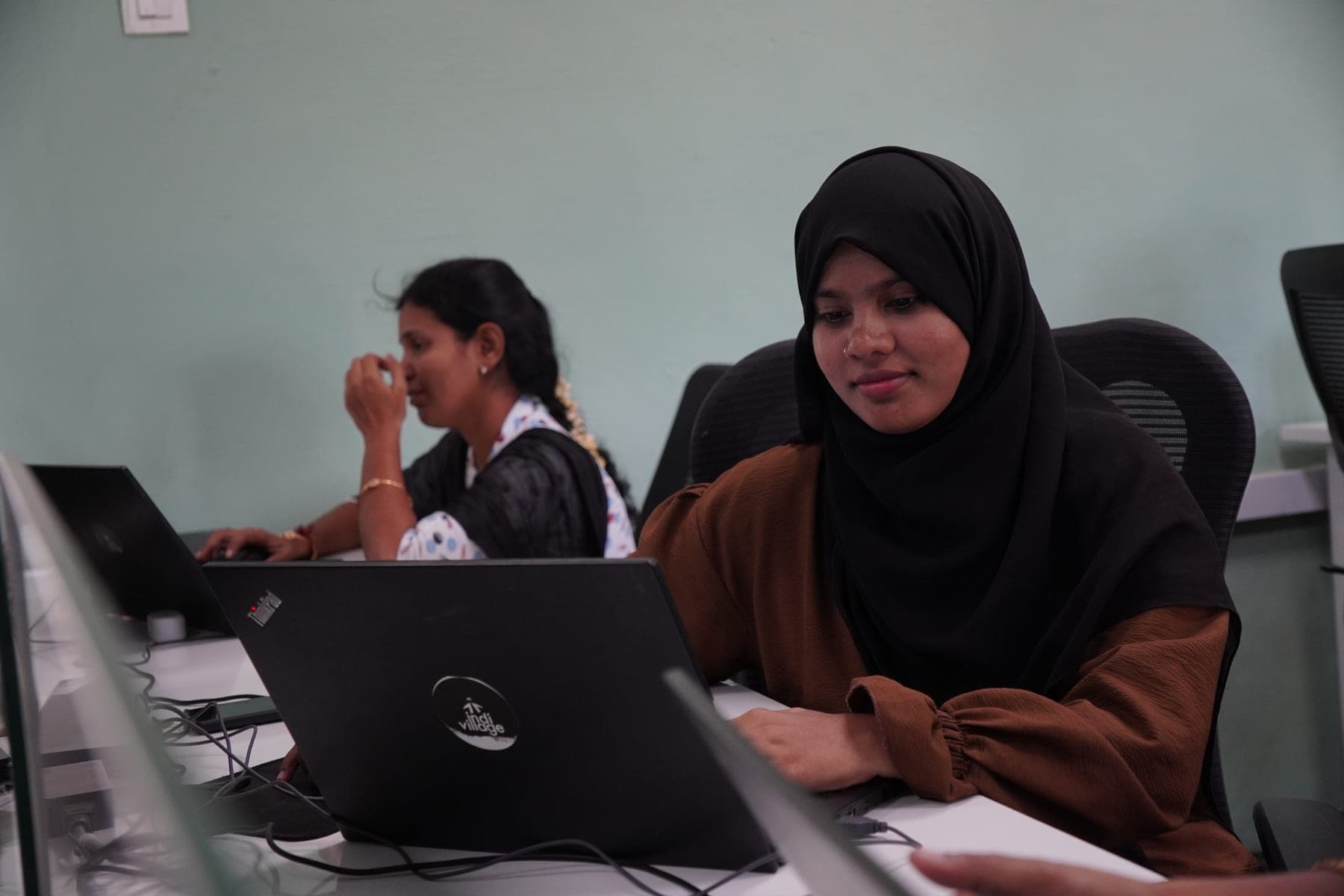 IndiVillage specialists at workstation
